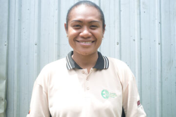 Alma is the first female coffee graduate placed with SMS-PNG. Image: Patrick McCloskey/CARE.